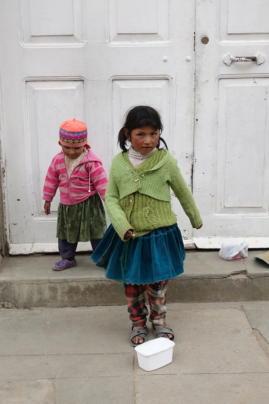 children dancing for money in Oruro, Bolivia