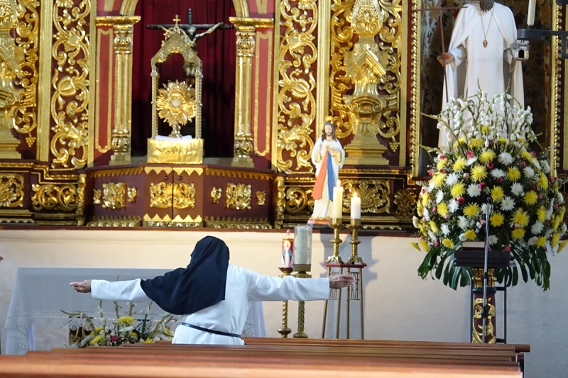 nun in Church in Cali, Colombia