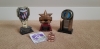 Three swimming trophies with one swimming medal